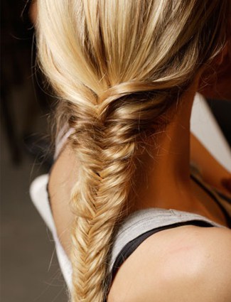 Fishtail plait tutorials - separate your hair into two big sections, then...